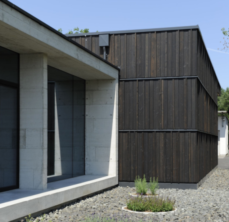 Treatments for wooden cladding