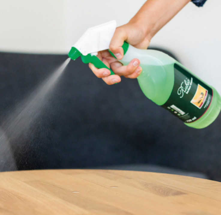 Removing stains from treated wood